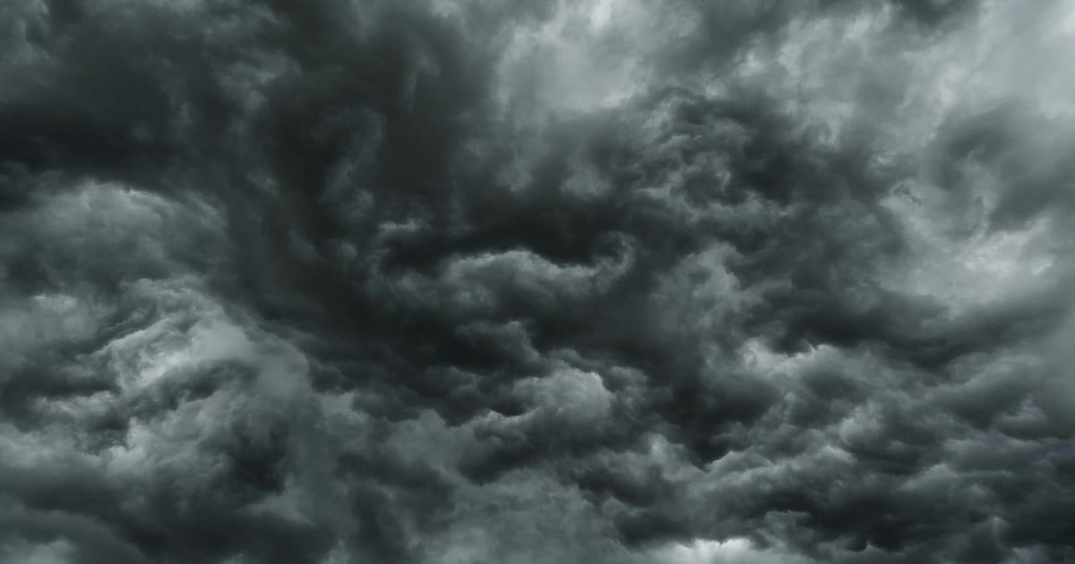 Dense dark storm clouds filling the frame with no horizon visible